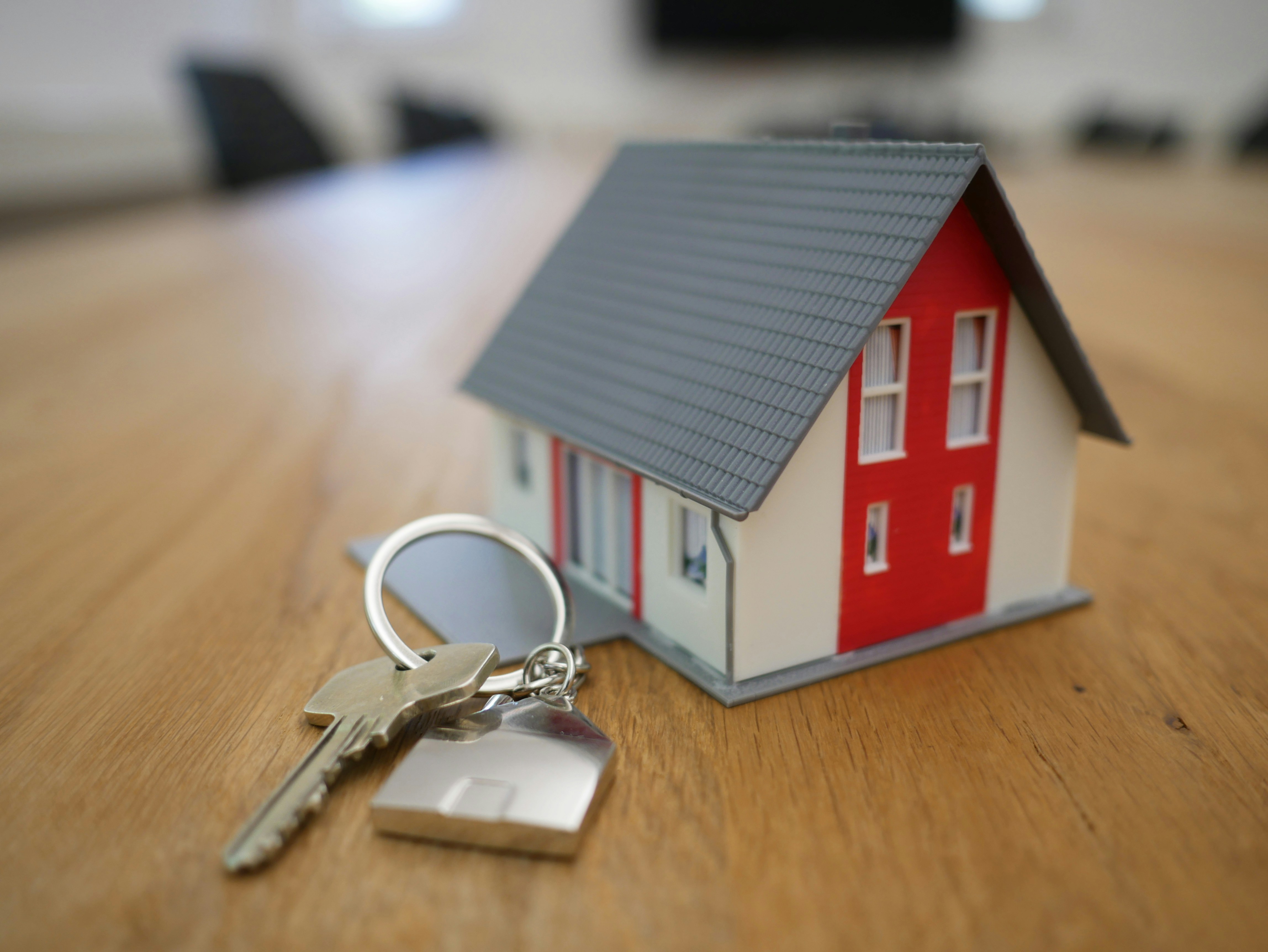 Miniature house model with keys.
