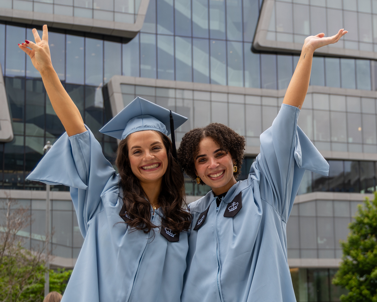 Two CBS graduates celebrate.