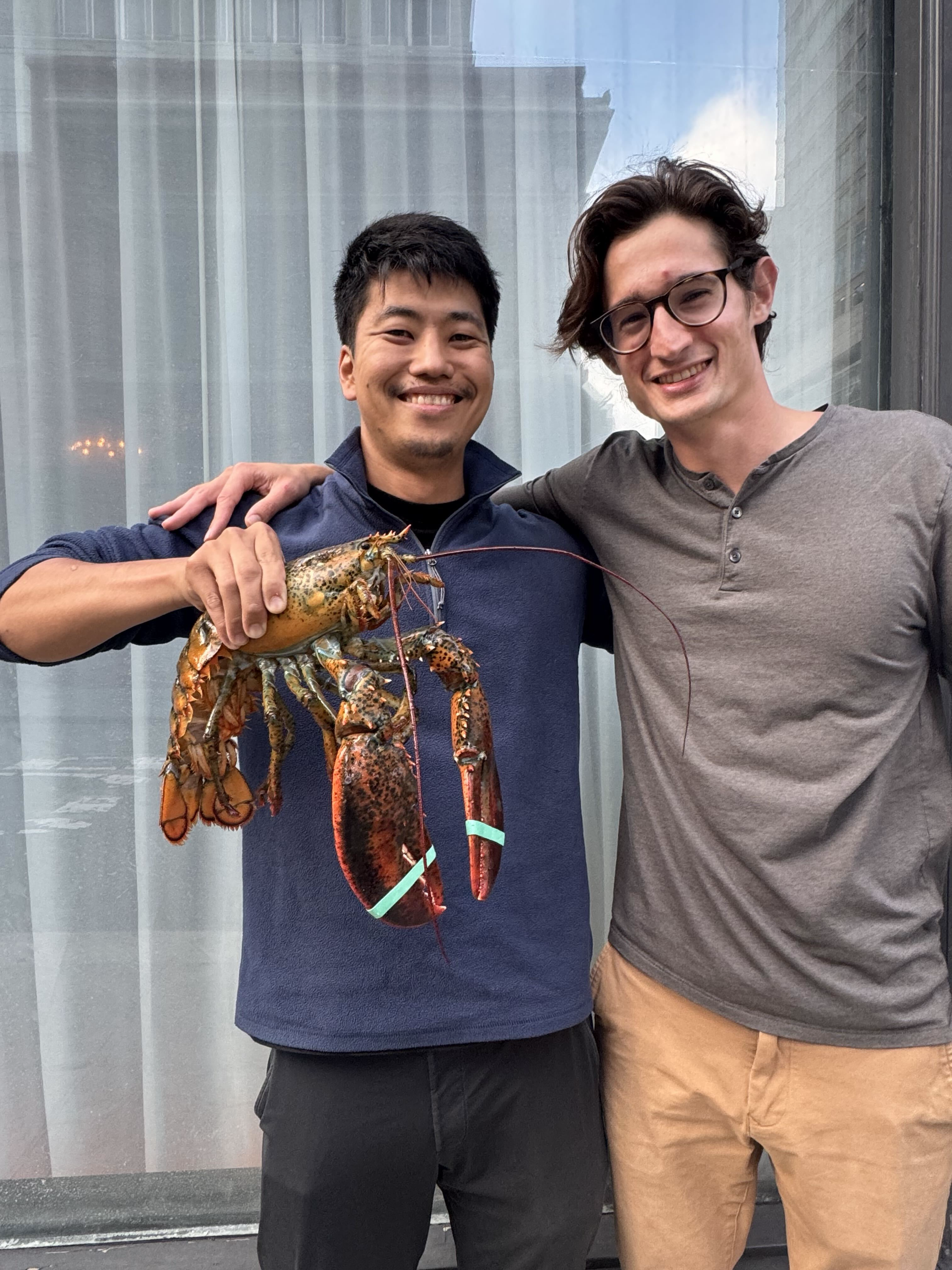 Yudai holds a lobster.