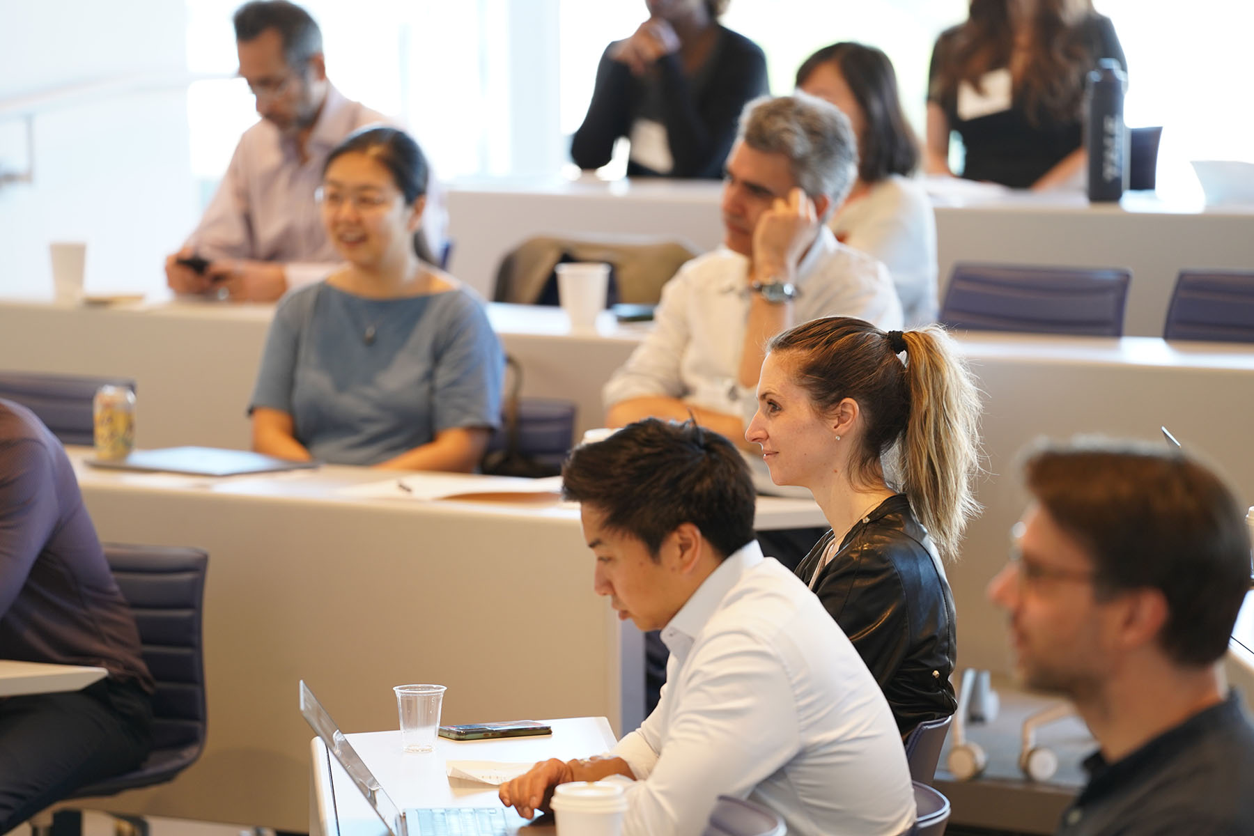 Faculty members in attendance at a seminar