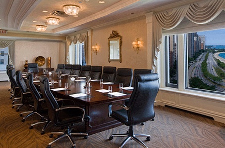 Boardroom with seats around long conference table
