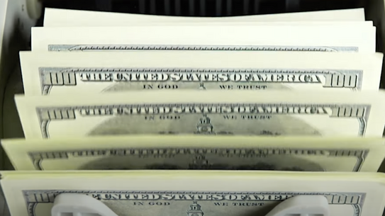 A stack of hundred dollar bills