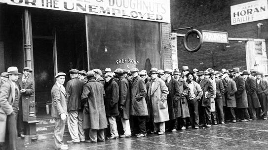 Unemployed men wait in line outside a soup kitchen opened in Chicago during the Great Depression