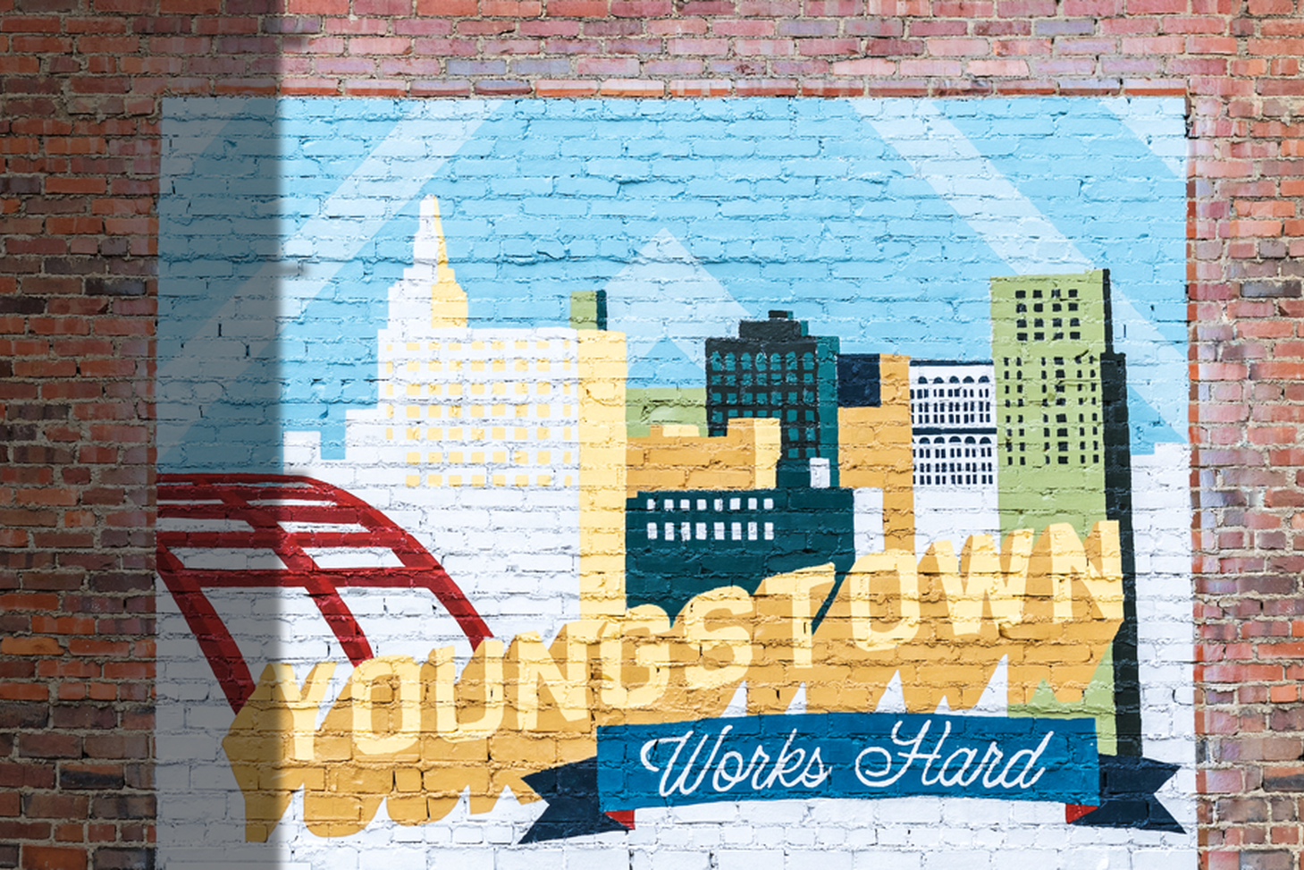 This mural on the Youngstown Business Incubator building was designed by local artist Salsi Salama and painted by Youngstown State University students.