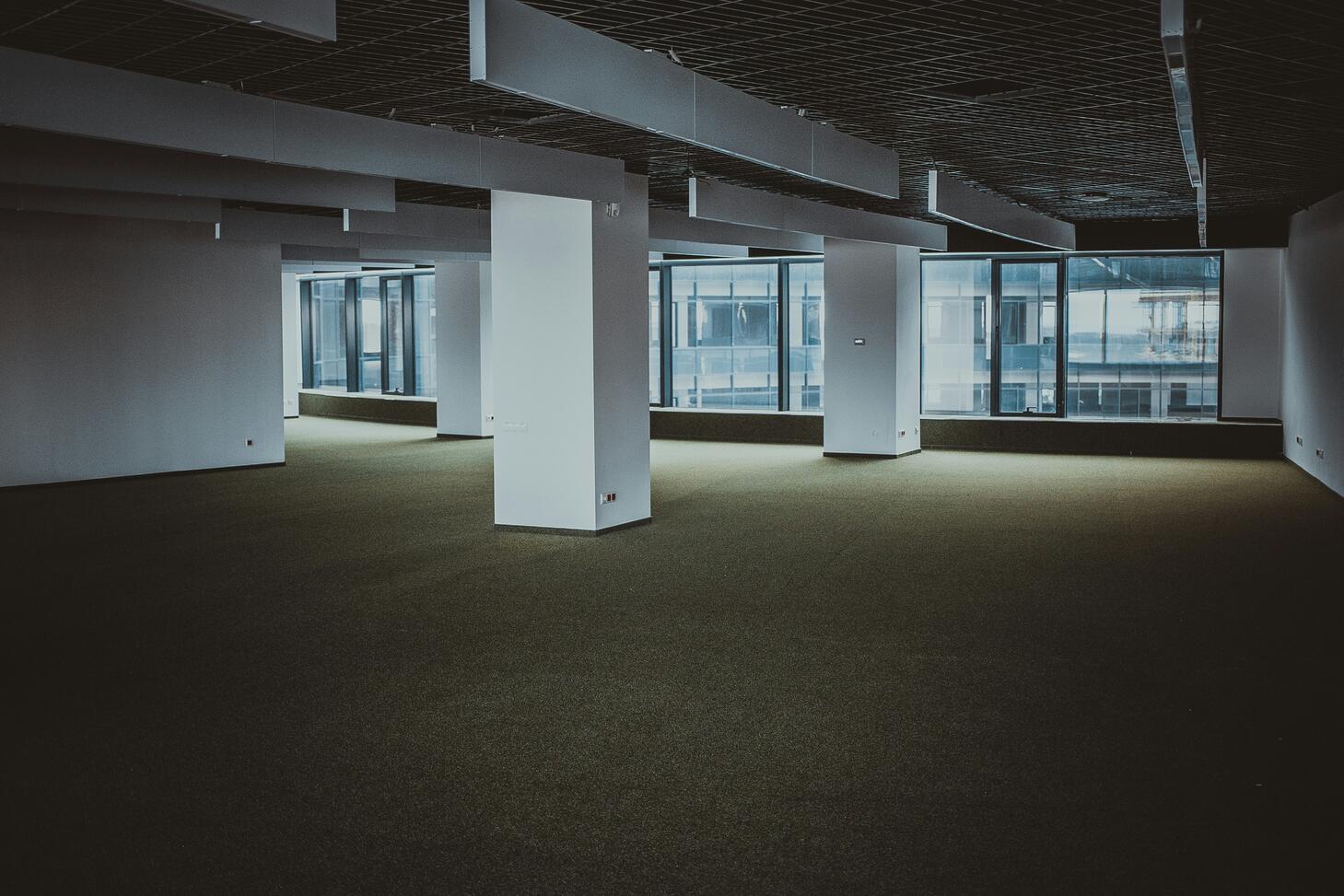 Empty brown and white building photo – Free Grey Image on Unsplash. Photo by Sergei Wing on Unsplash.