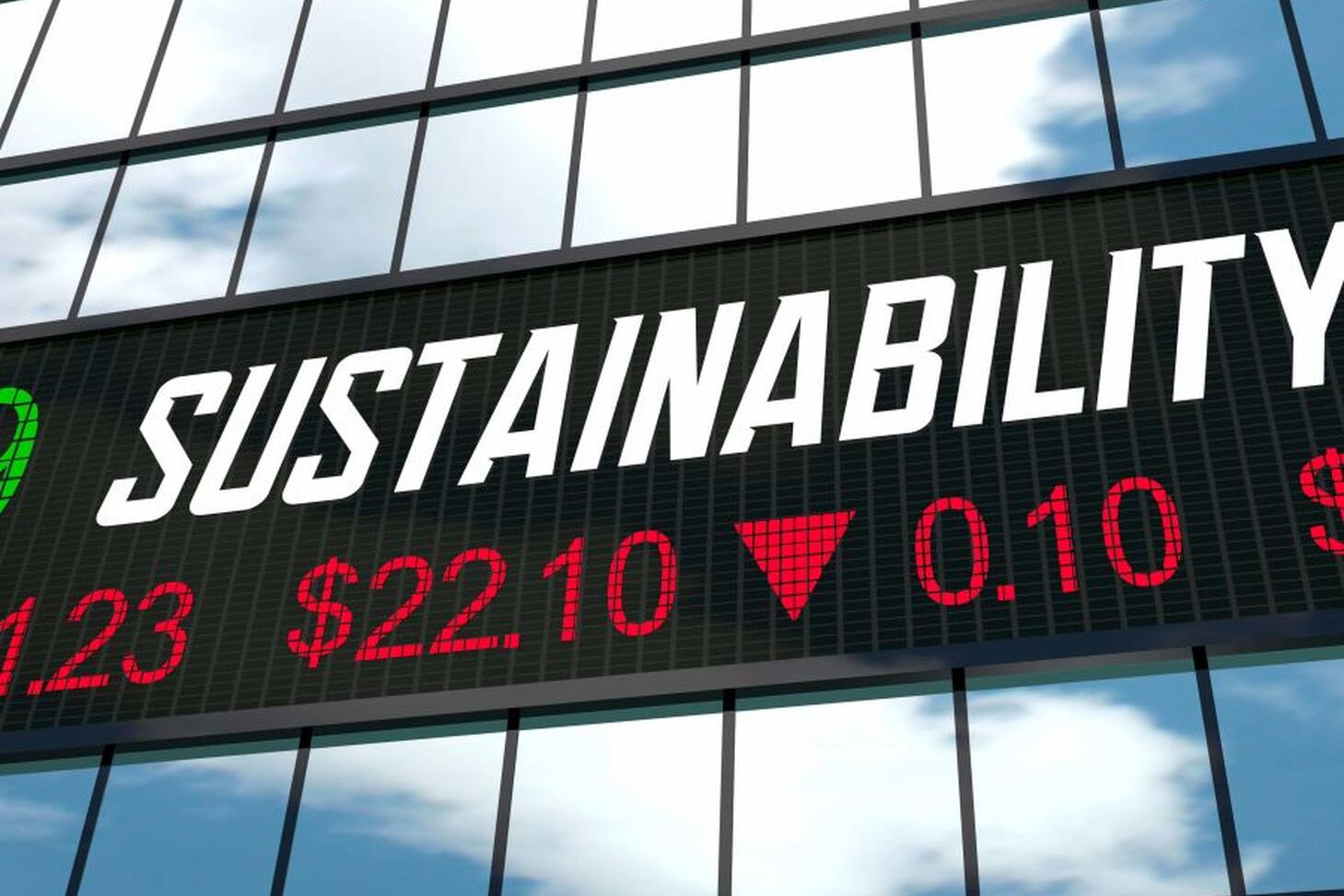 NASAQ index on the side of a glass building, with the word SUSTAINABILITY