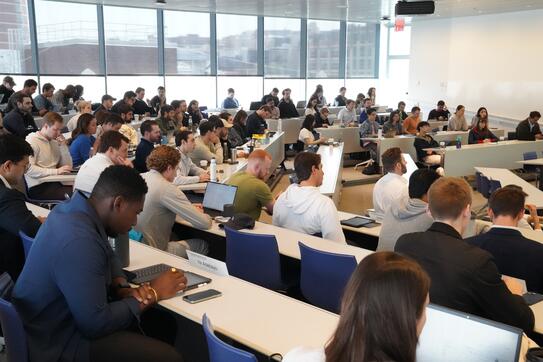 Students listening to speaker at Private equity finance class