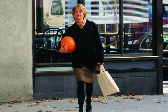Meg Ryan carrying a pumpkin 