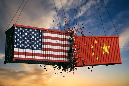 Two shipping containers, one painted with the American flag and the other with the Chinese flag, collide in mid-air