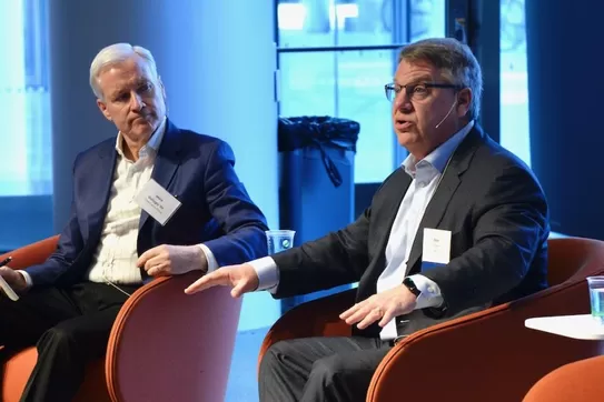 Moderator Mark Gallogly '86, left, cofounder of Three Cairns Group, and Rich Lesser, global chair of the Boston Consulting Group, speak at the 2022 Climate Business & Investment Conference