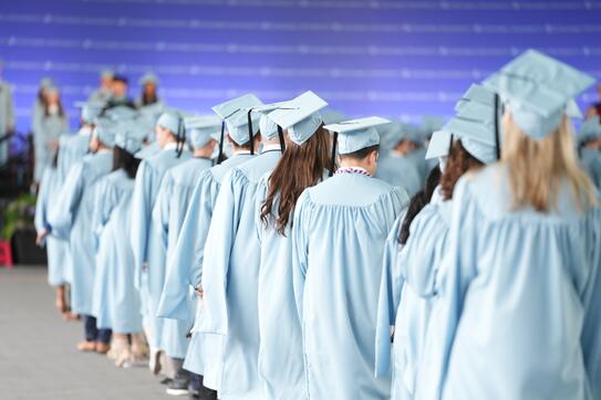 CBS graduates in cap and gown, lined up