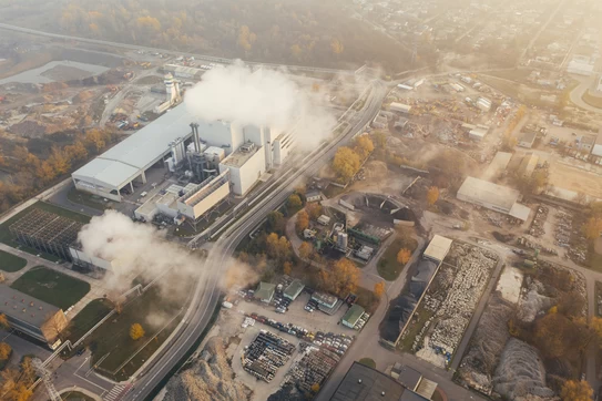 white smoke coming out from building. Photo by Marcin Jozwiak on Unsplash.