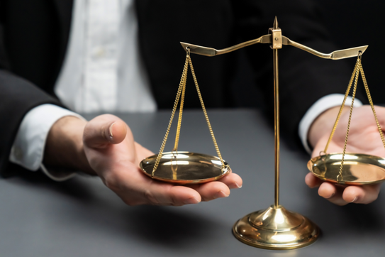 hands weighing a scale
