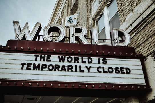 theater marquee saying the world is temporarily closed