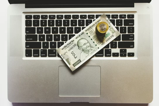 Money on a computer keyboard