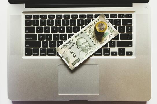 Money on a computer keyboard
