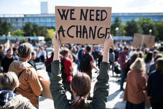 A protestor holding a placard