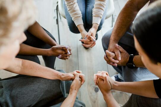 Diverse group practicing religion