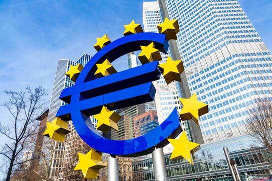 Famous euro sign in Frankfurt am Main under blue sky.