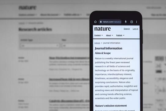 A research paper on a phone screen