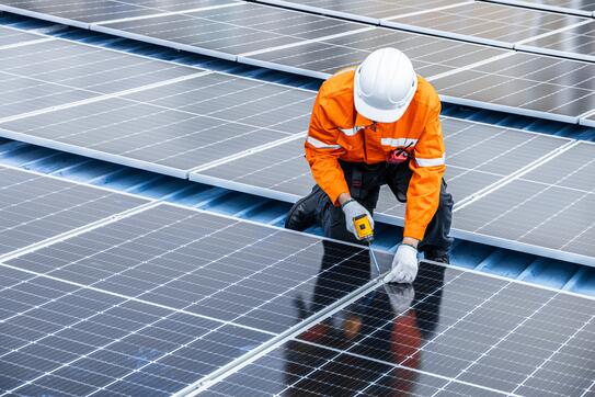 Technician working on solar panels