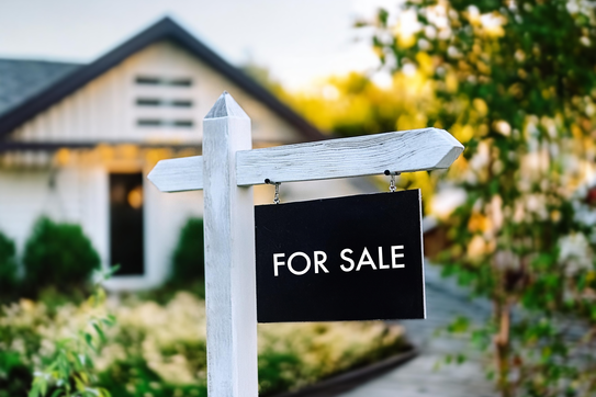 For Sale sign outside of a home