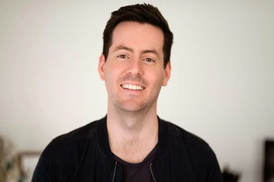 A man smiling for the camera photo – Free Business man Image on Unsplash. Photo by The Connected Narrative.