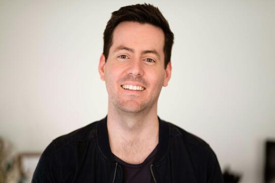 A man smiling for the camera photo – Free Business man Image on Unsplash. Photo by The Connected Narrative.