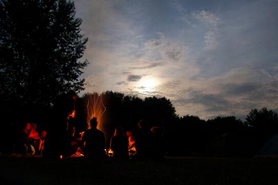 people around a campfire