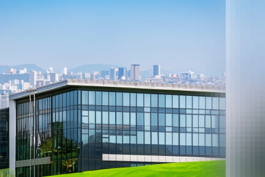 corporate building with a city scape behind it