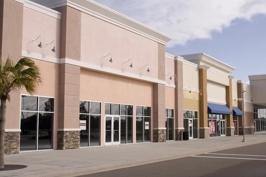 A strip mall of several retail stores.