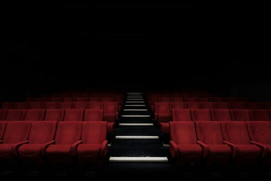 Rows of seats in a dark theater