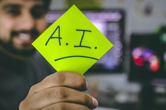 A sticky note with the letters "A.I." on it