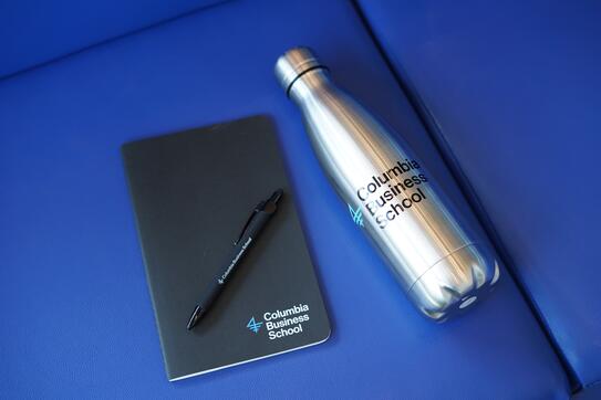 A CBS-branded notebook, pen, and waterbottle