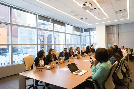 Image of workers around table
