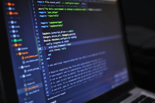 Extreme closeup of a computer screen with lines of code on it