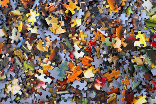 a large pile of puzzle pieces