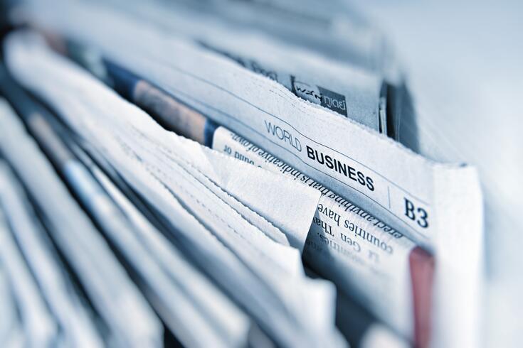 Business newspaper pages. Photo by AbsolutVision on Unsplash.