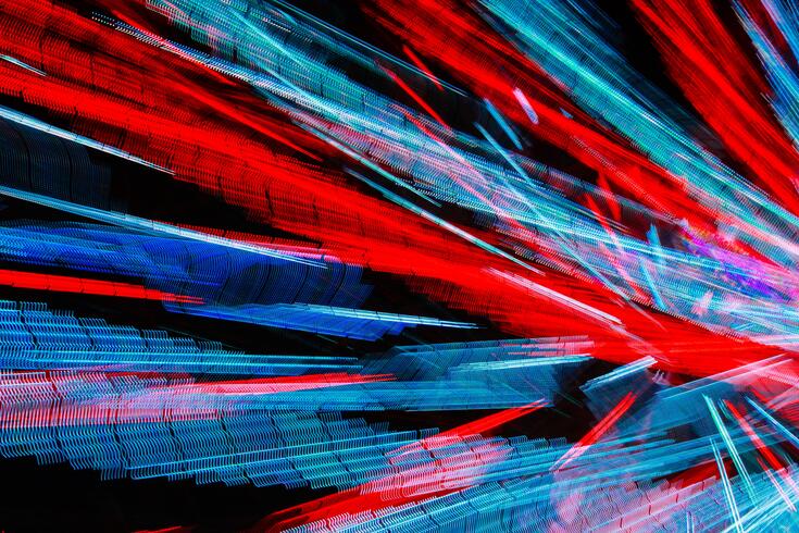 An abstract image of red and blue laser lines
