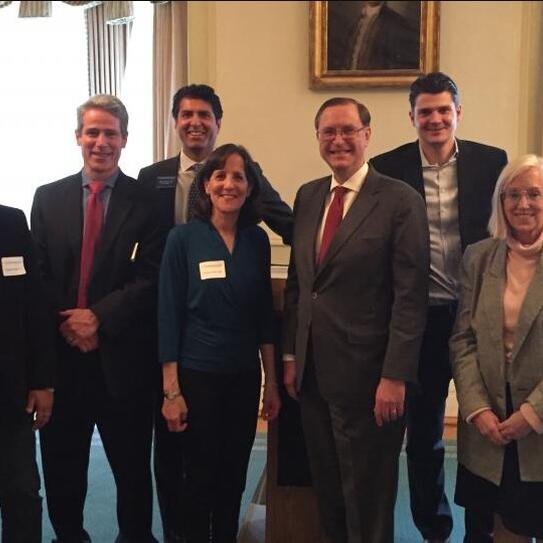 Dean Glenn Hubbard (front row, second from left) attended a graduation ceremony marking the first year of the Alumni Club of Boston's mentorship program. This year, the program has 11 mentor-mentee pairs from a wide range of graduating years.