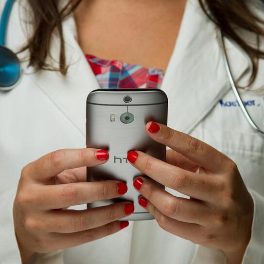Doctor holding a phone