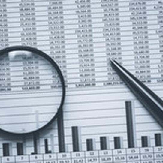 data with graph under a magnifying class