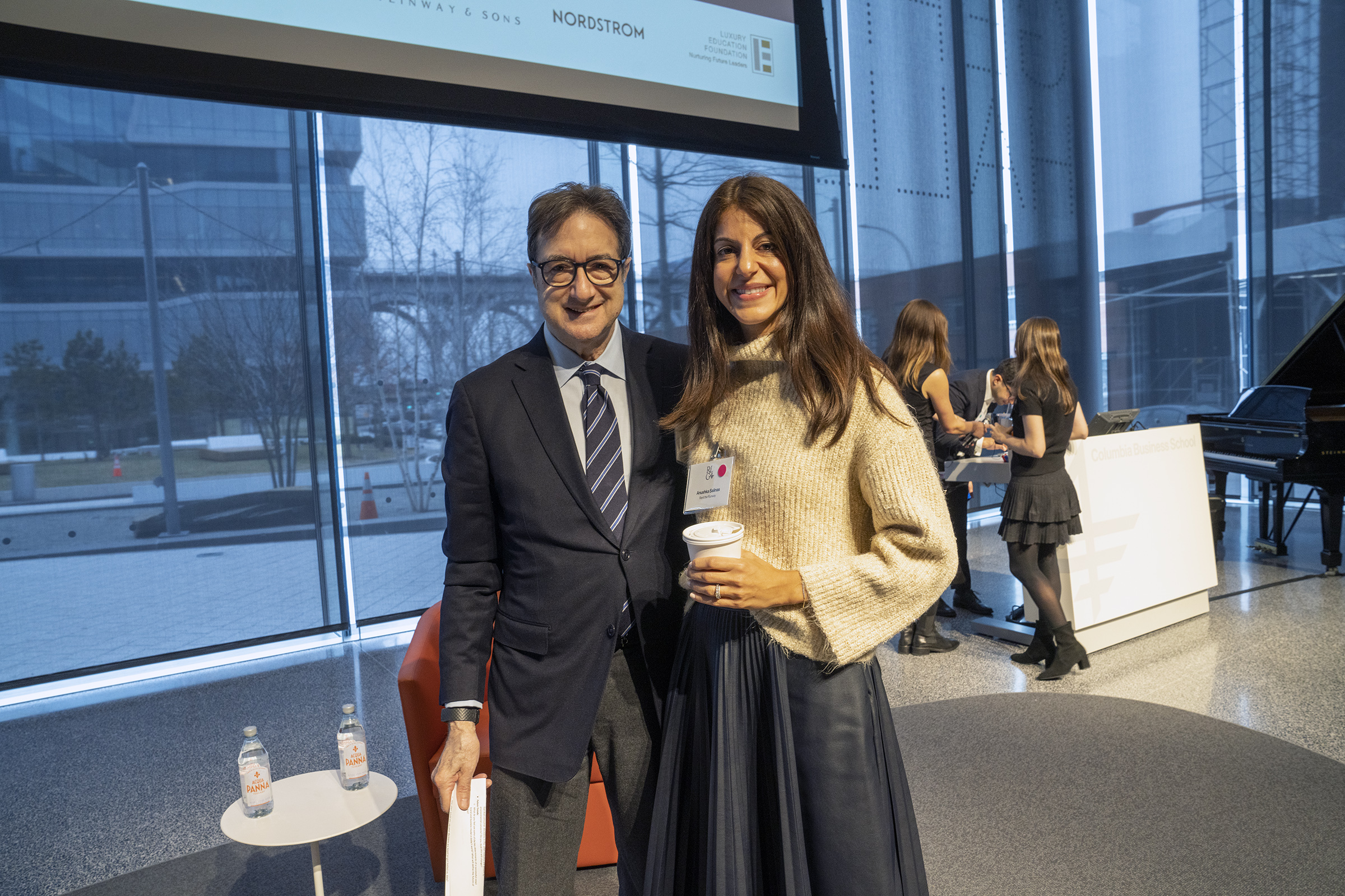 Professor Mark A. Cohen, left, with Anushka Salinas '10, president and COO of Rent the Runway